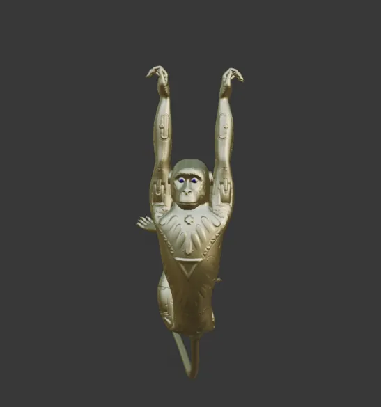 El macaco de Huk en oro, con los brazos arriba y la cola colgando, en Blender.