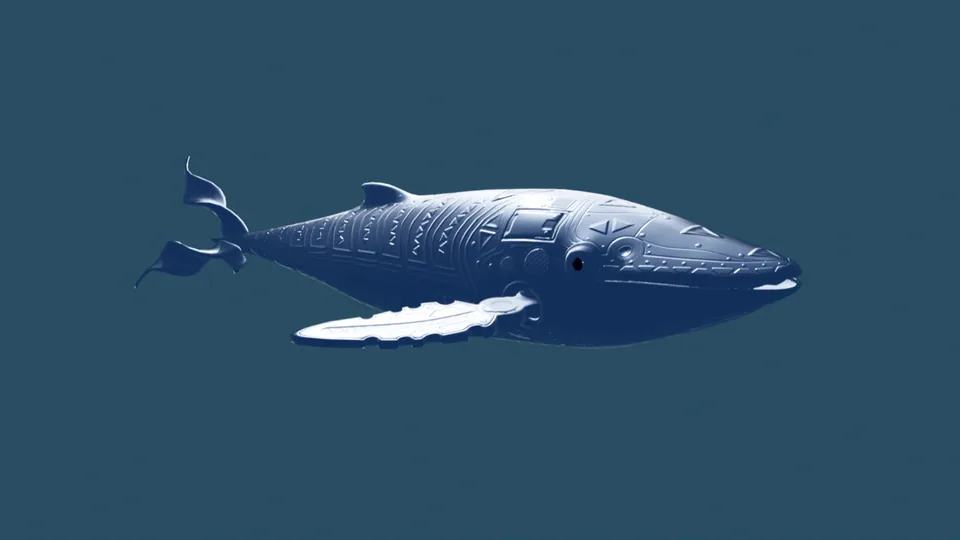 Yakumama, una ballena plateada con la piel tallada de dibujos, flota sobre un fondo azul.